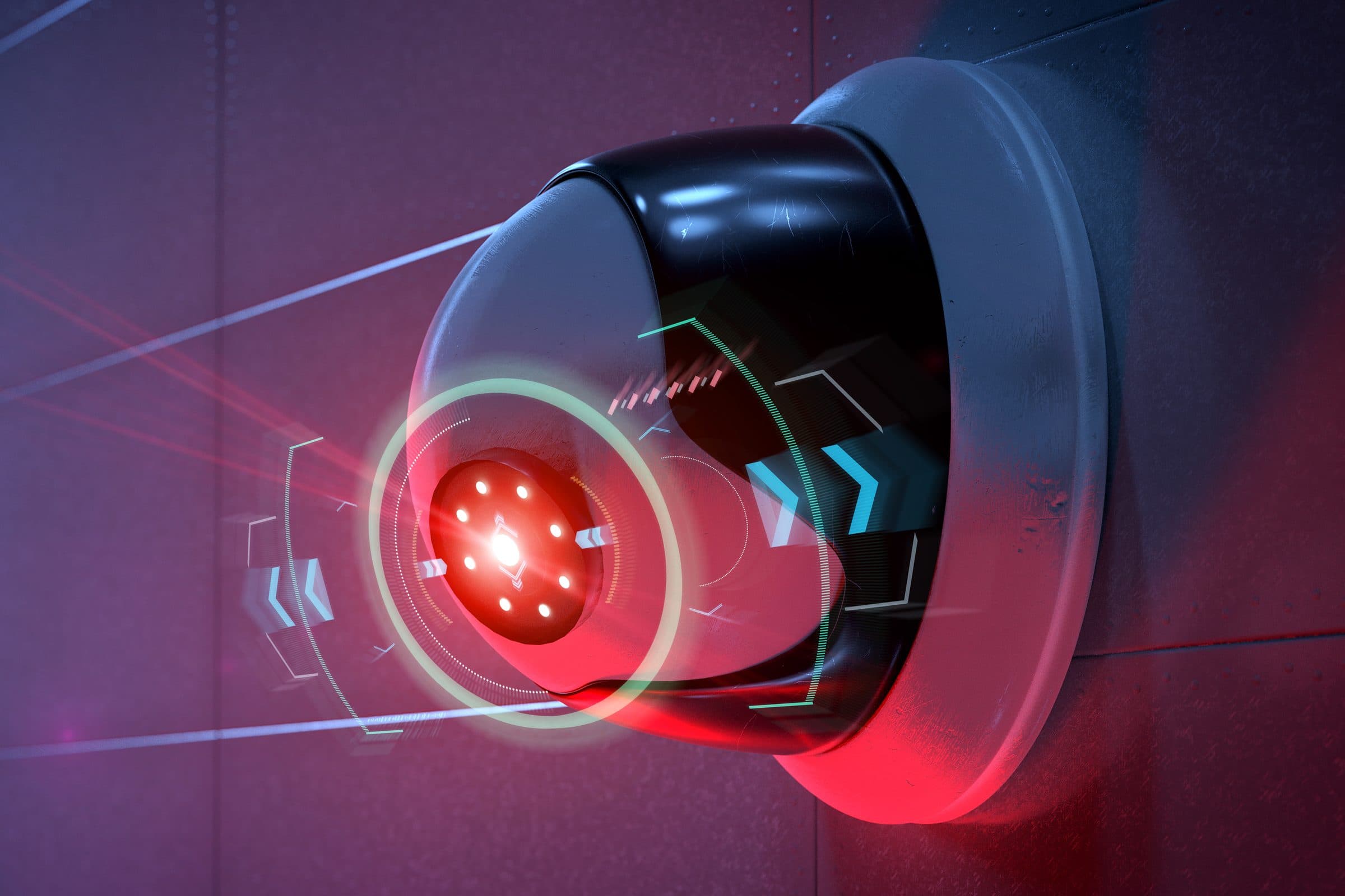 Telecamera dome di videosorveglianza con la luce rossa accesa, fissata a una parete